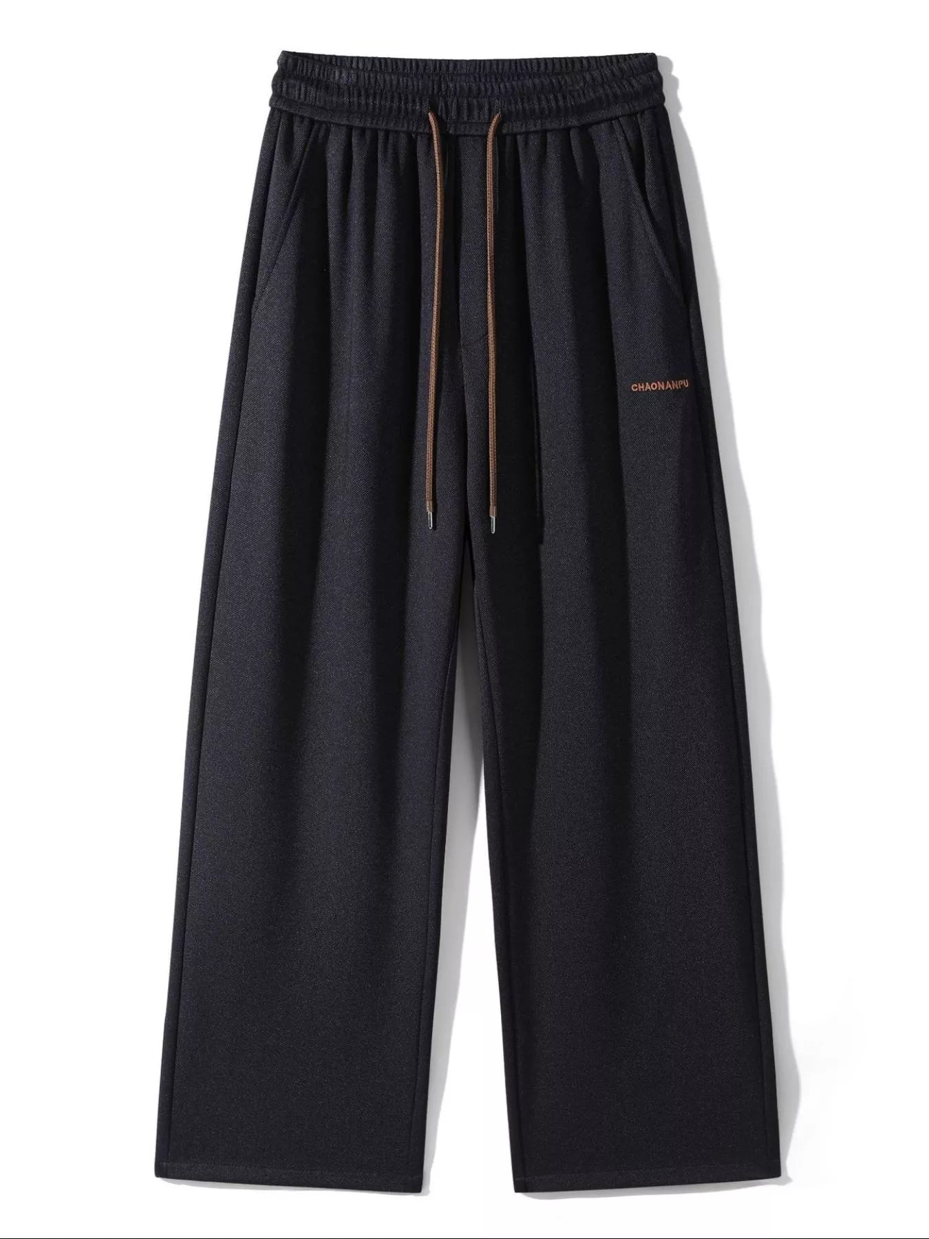 Men's loose fit casual pants with a drawstring waist and pockets.