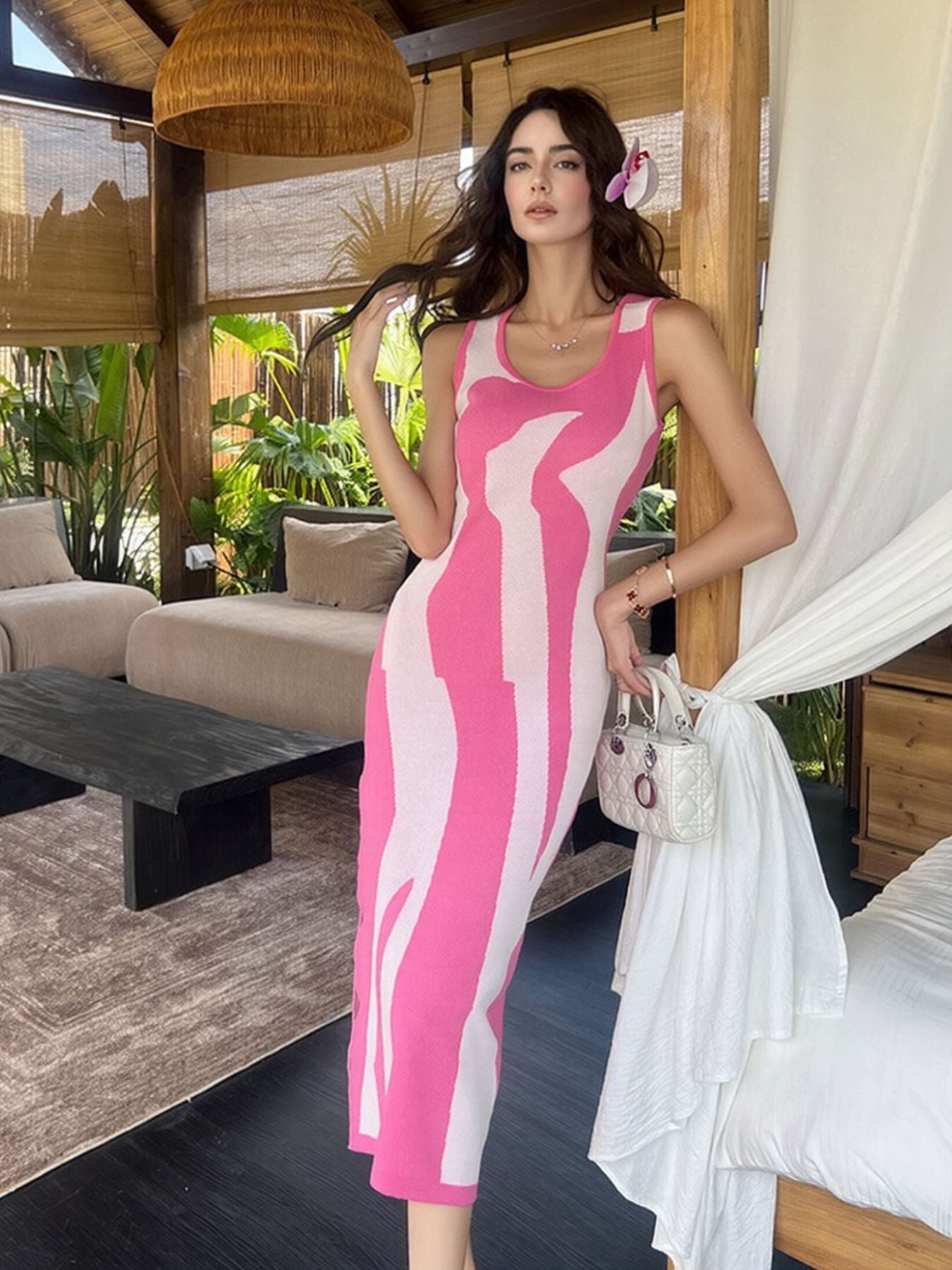 Pink and white wavy contrast sleeveless bodycon midi dress worn full length indoors