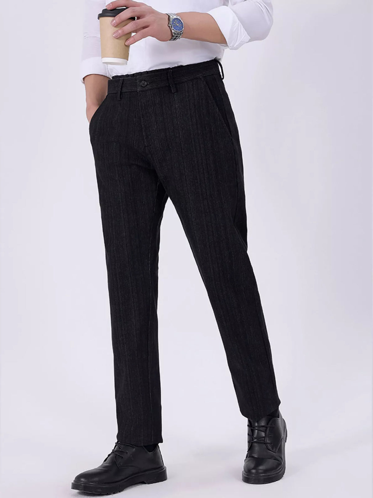 Men's black slim-fit pants with pockets and a cotton-blend composition.