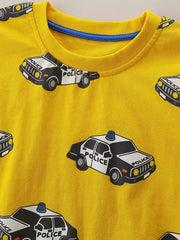 Close up of yellow children's t-shirt round neckline with blue inner trim and police car print