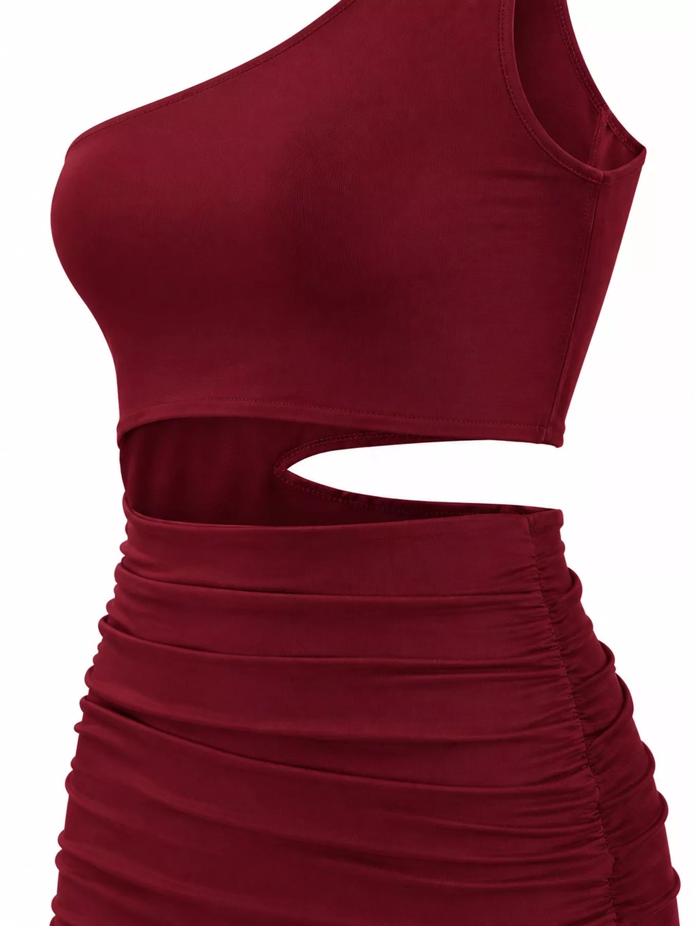 Close detail view of burgundy one shoulder cutout ruched bodycon mini dress bodice and waist cutout