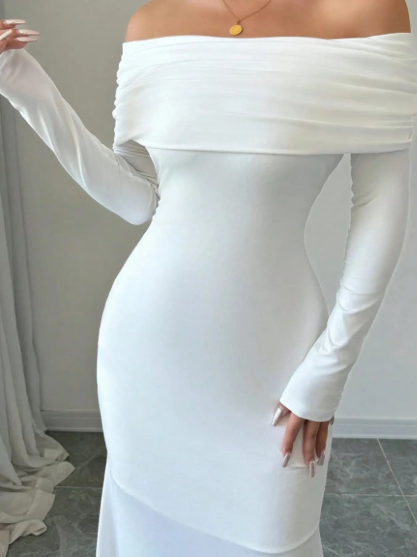 Close front view of white off shoulder bodycon maxi dress with draped neckline