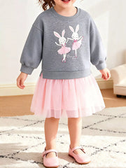Child wearing gray sweatshirt with pink ballerina bunny graphic, layered pink tulle skirt, and matching Mary Jane shoes