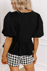 Blusa con cuello redondo y mangas abullonadas con aberturas