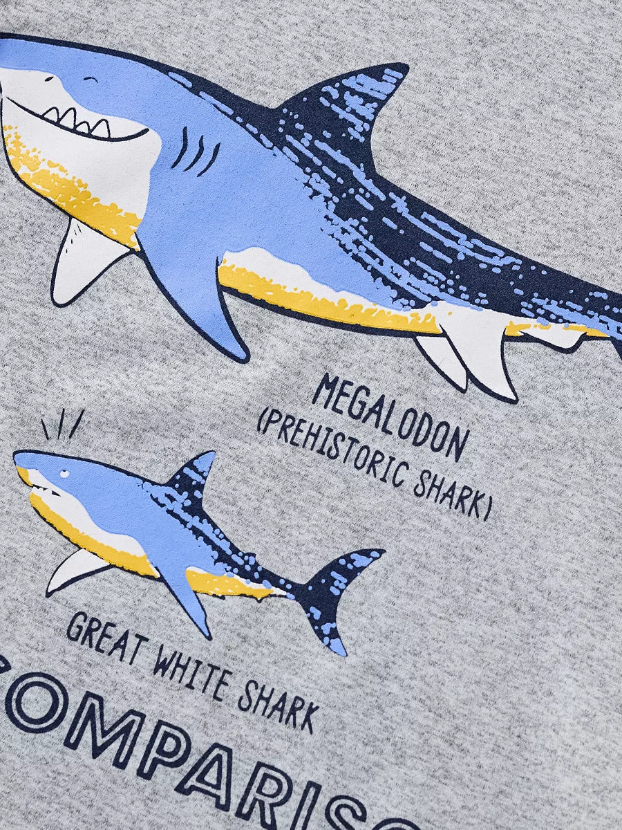 Close up of the megalodon and great white shark labels on the gray T-shirt