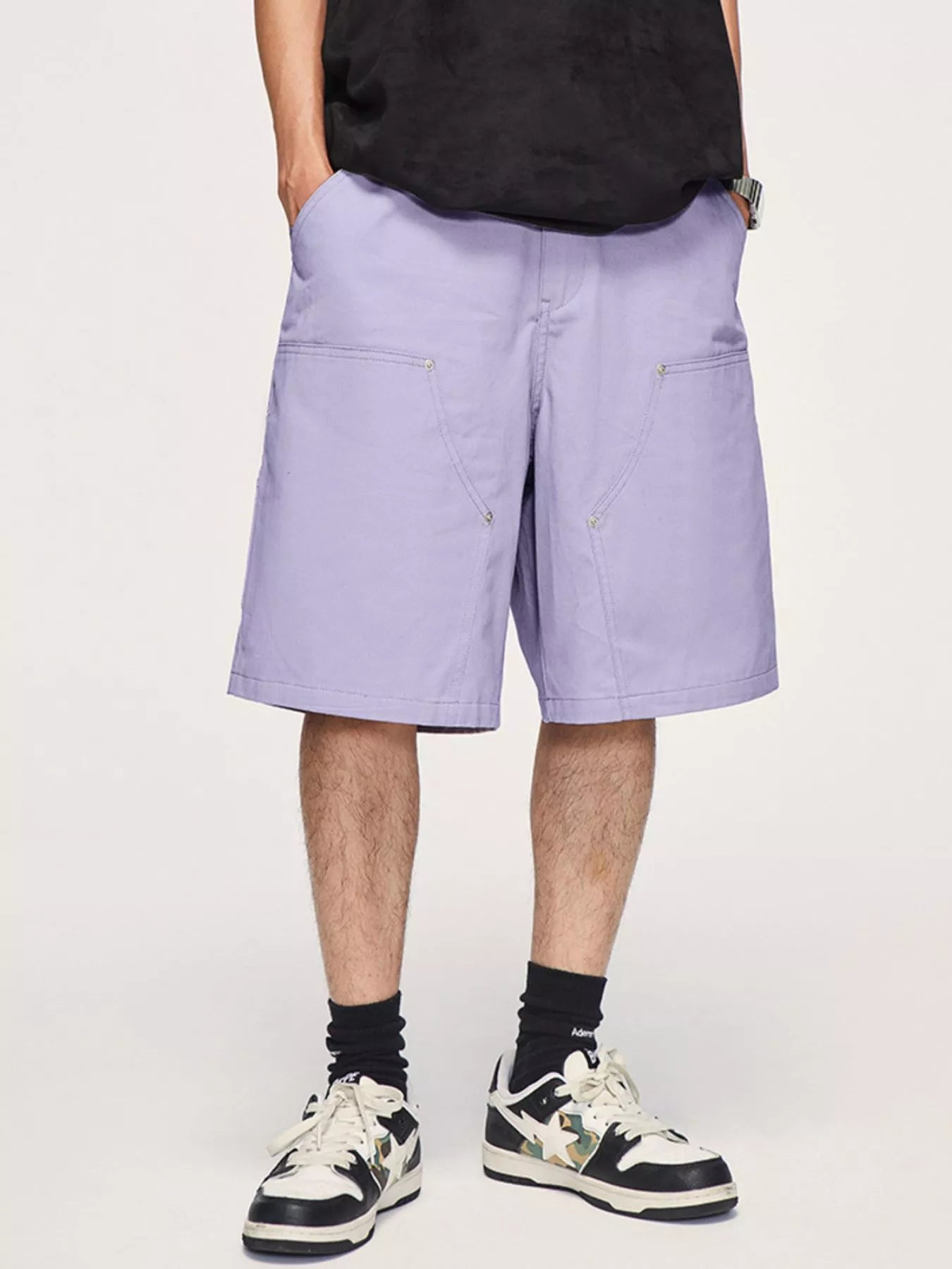 Men's casual loose fit shorts with a drawstring waist and pockets.