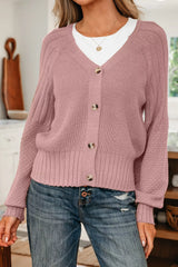 On-model front view of a dusty pink V-neck button-down cardigan with textured long sleeves