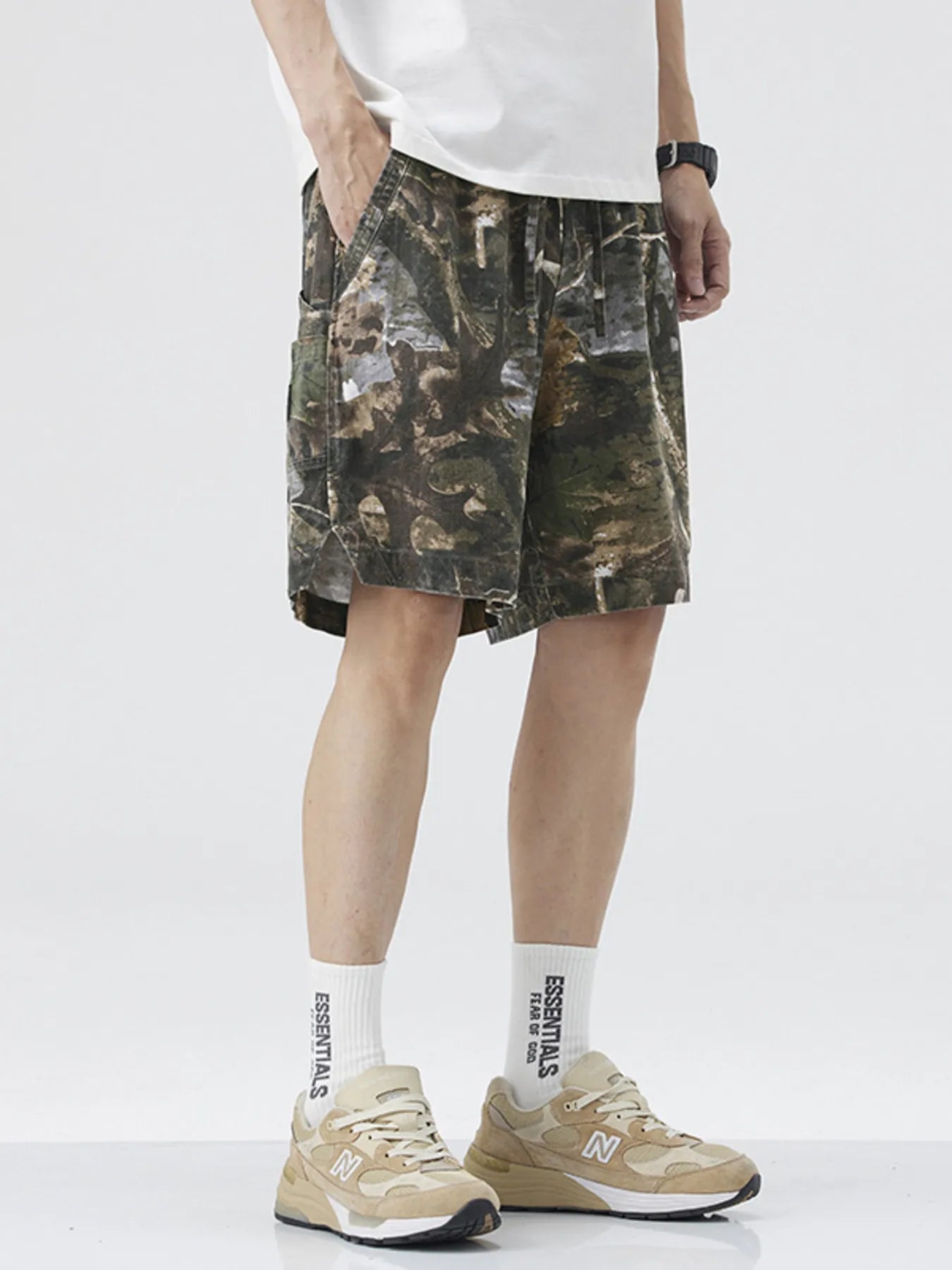 Men's loose fit shorts with a drawstring waist and pockets.