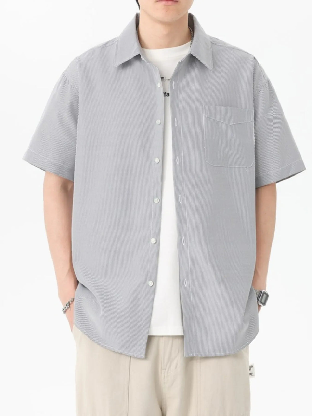 Men's oversized short-sleeve shirt with button detailing in a cotton-spandex blend.