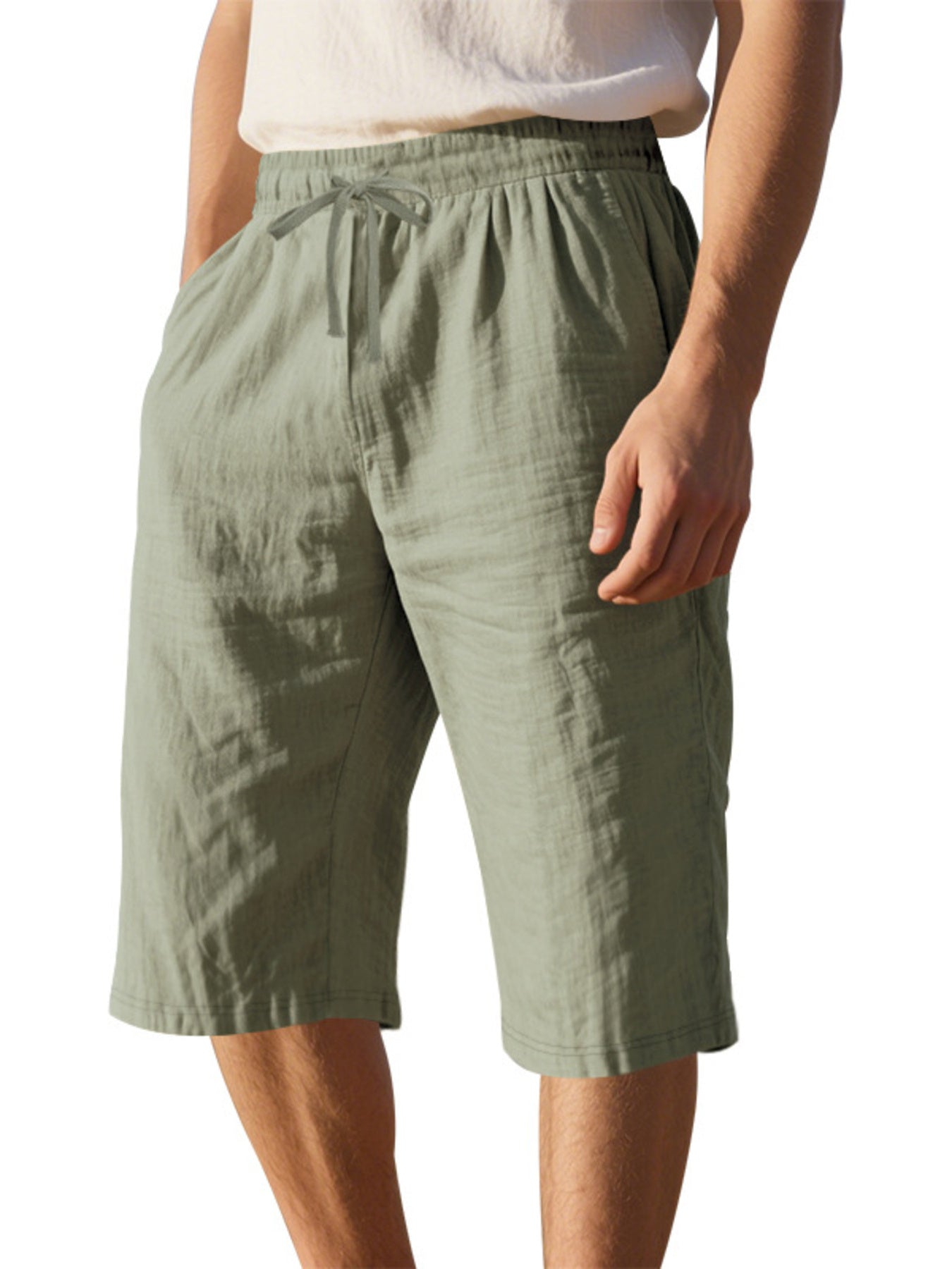 Men's casual shorts with a drawstring waist and pockets in the military green color.