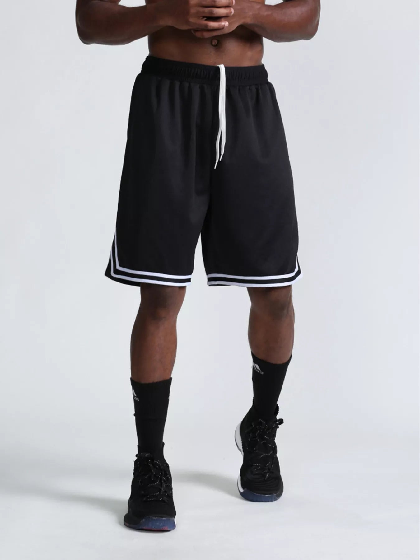 Men's black athletic shorts with a drawstring waist and pockets.