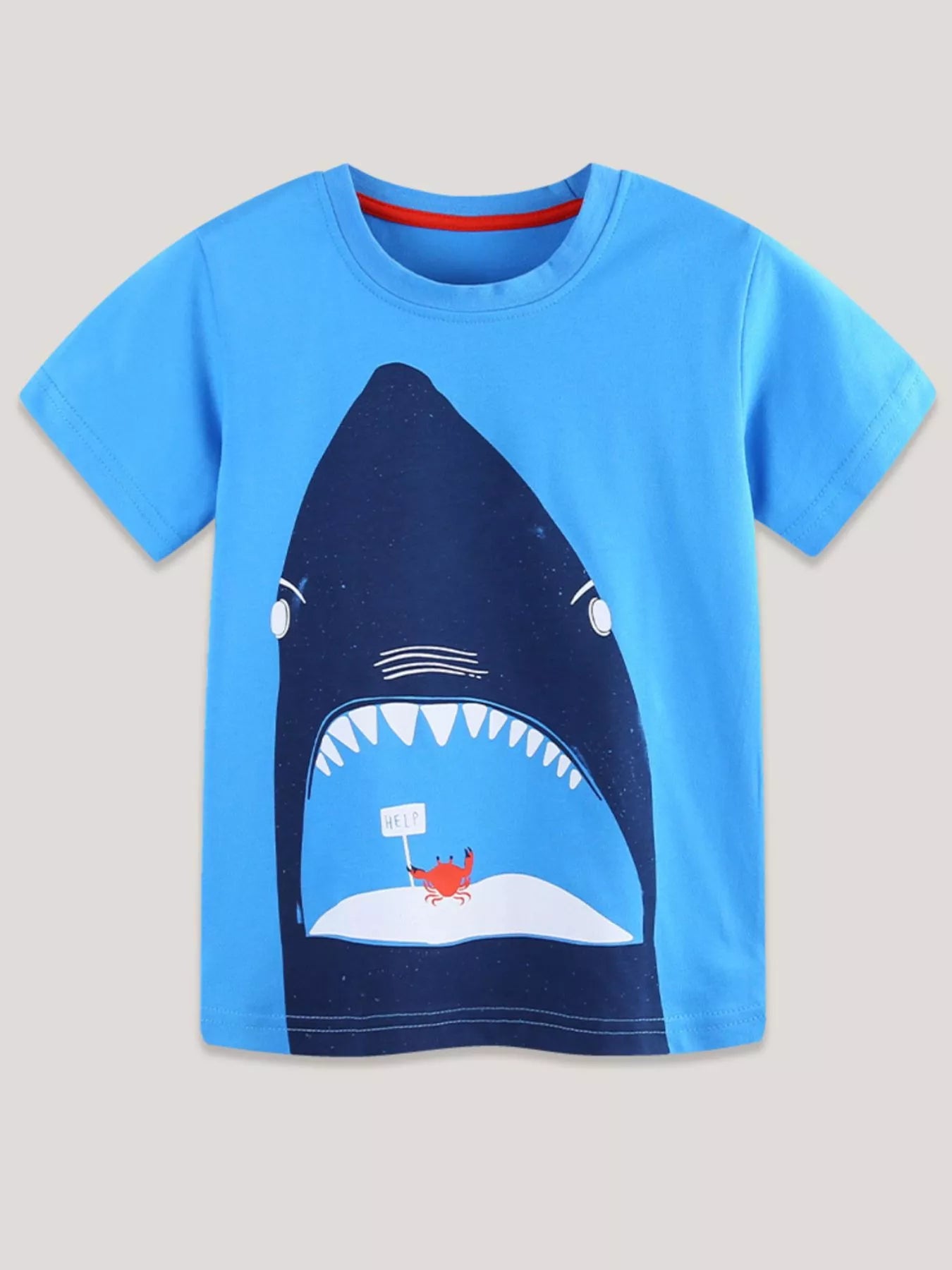 Sky blue children's short sleeve t-shirt laid flat with large dark blue shark and red crab print