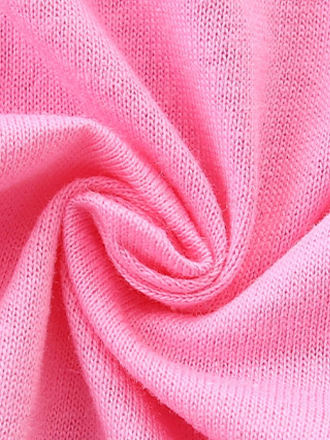 Close up of soft pink knitted fabric texture of children's short sleeve t-shirt