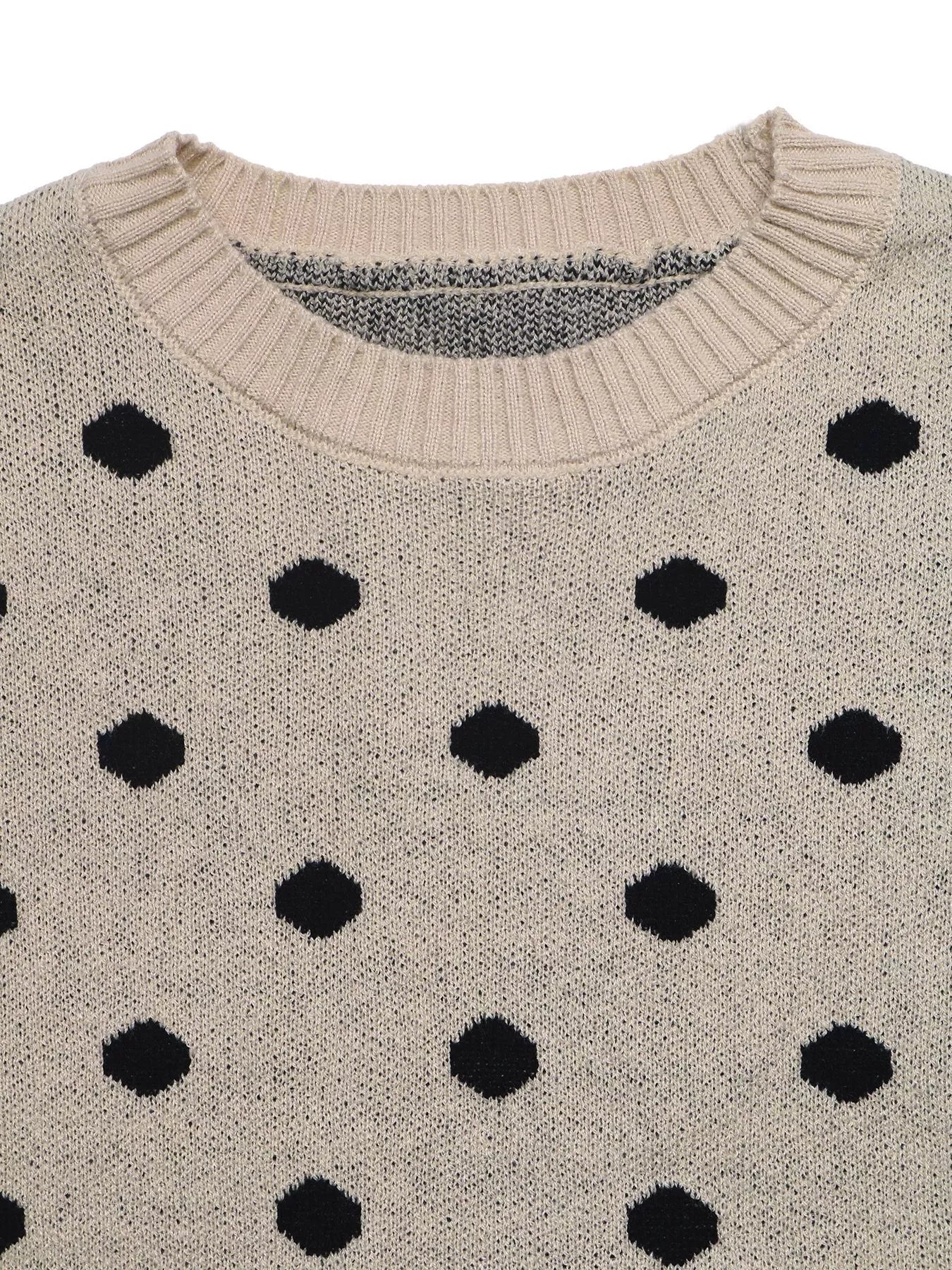 Close up flat lay of khaki polka dot sweater ribbed round neckline detail