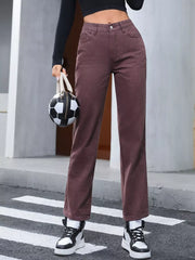 Women's dark brown straight-leg jeans with buttons and pockets.