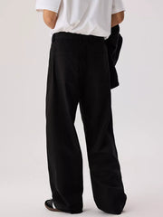 Men's relaxed fit pants with a drawstring waist and pockets.