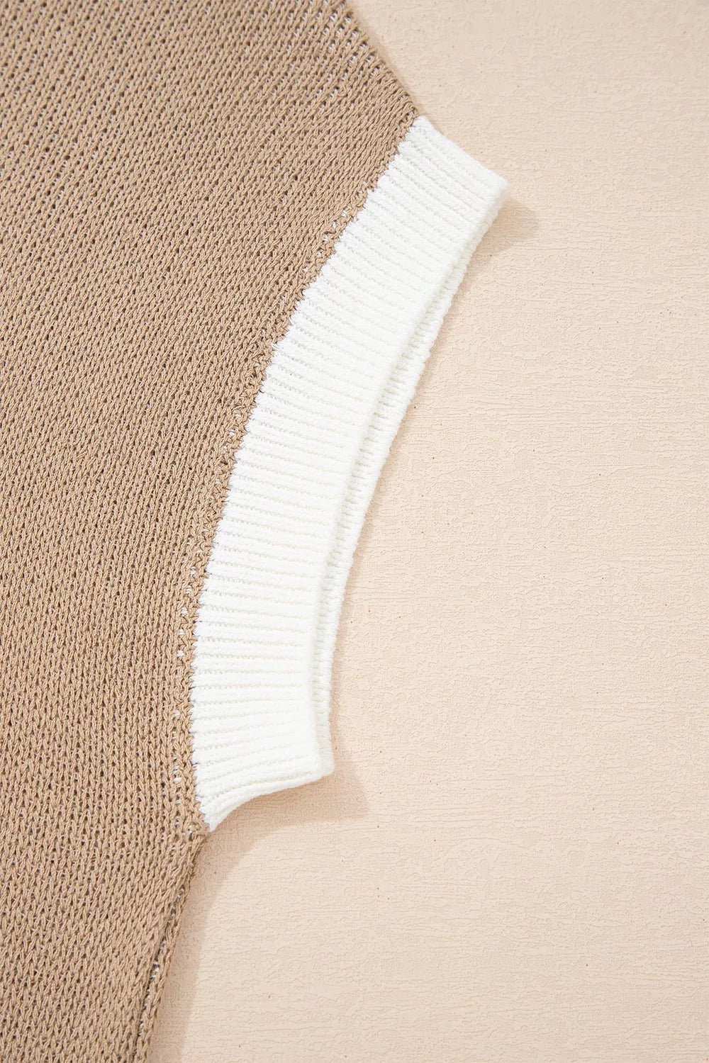 Close-up of the mocha sweater white ribbed short sleeve trim
