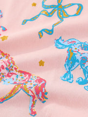 Close view of the colourful horse and bow print on the pink children's short sleeve tee