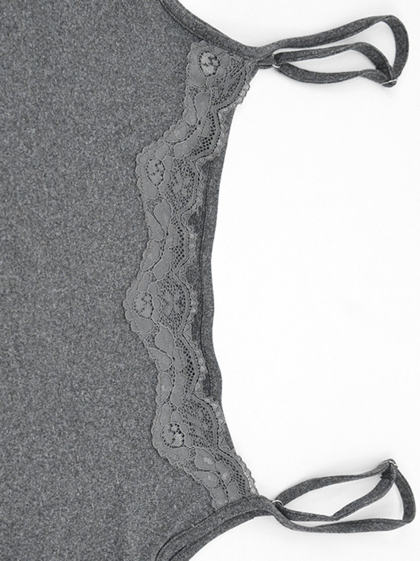 Close view of grey lace panel and straps on the bodycon mini dress