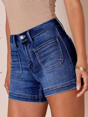 Women's high-waisted denim shorts with pockets and slightly stretchy fabric.