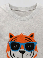 Close-up of the light gray round neckline above the orange tiger wearing blue sunglasses