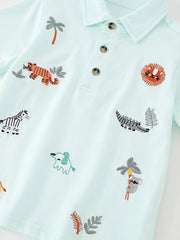 Angled front view of the mint blue polo showing embroidered tiger, lion, crocodile and koala motifs