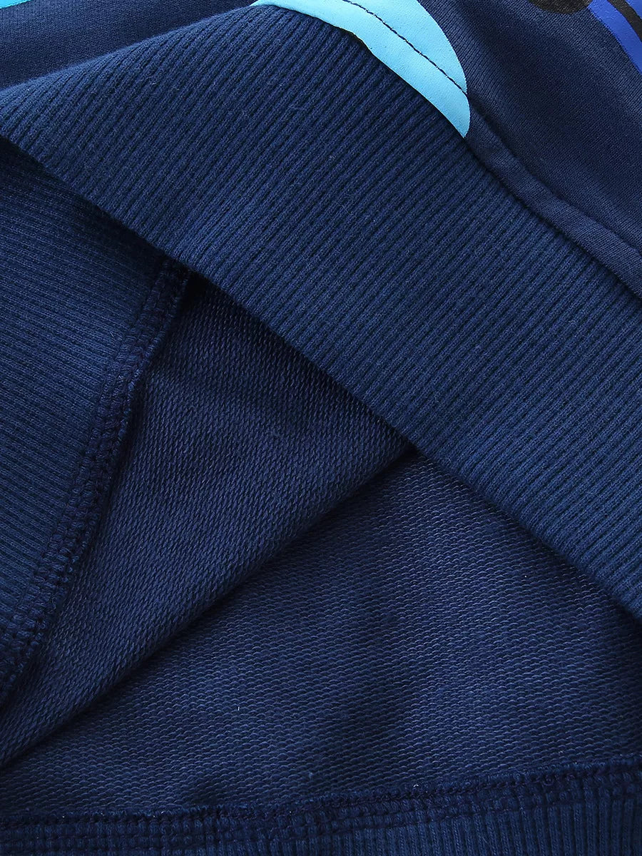 Close-up of the navy ribbed hem and soft inner lining of the children's sweatshirt