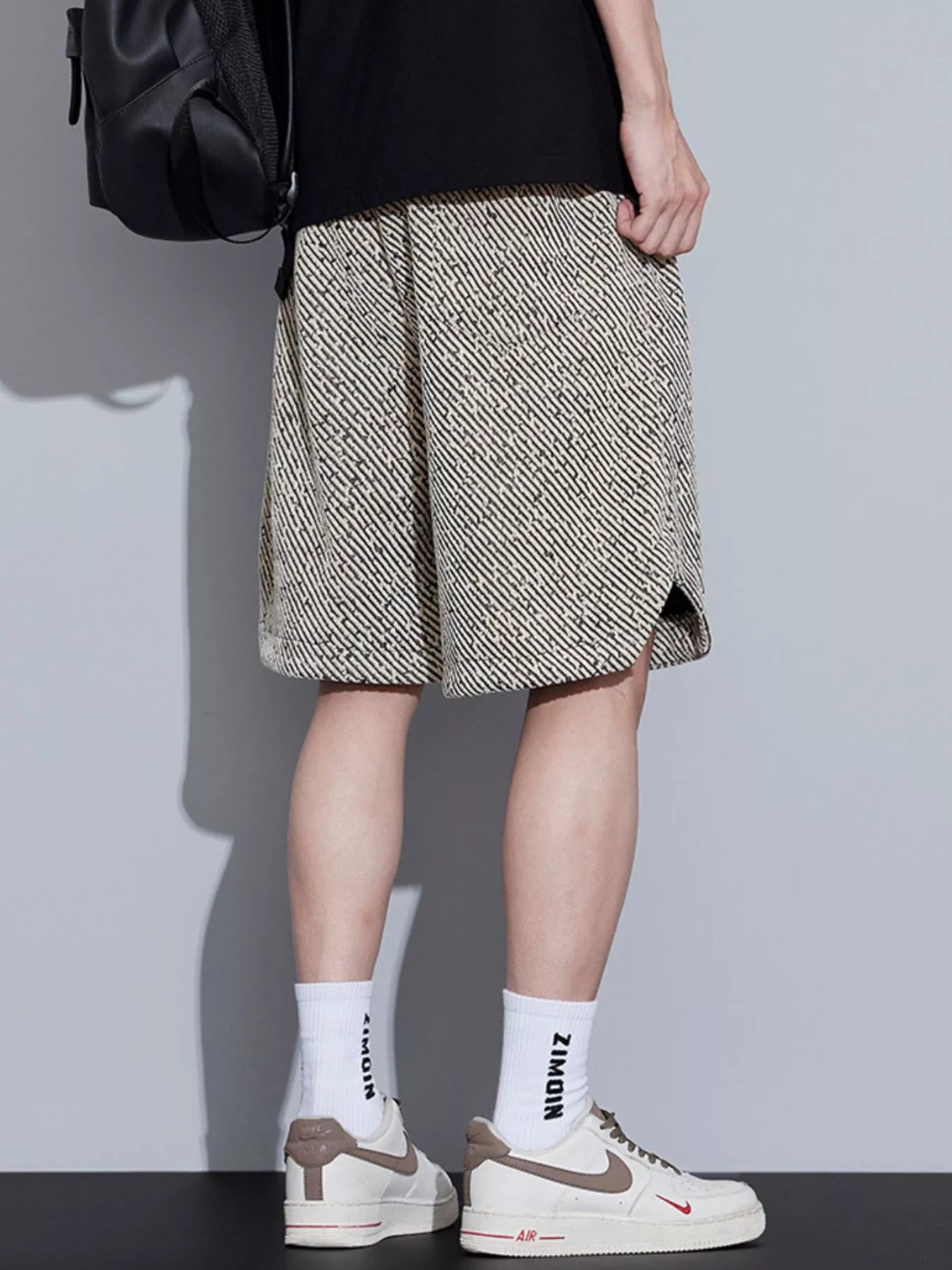 Men's loose fit shorts with a drawstring waist and pockets.