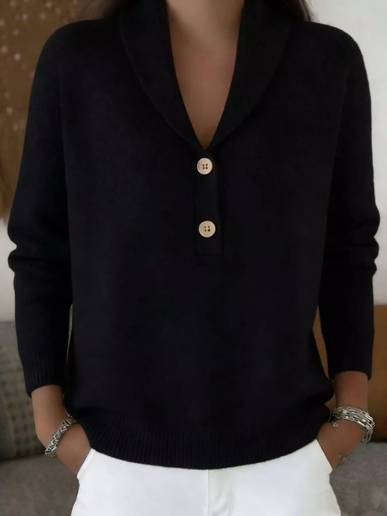 Closer on-model front view of the black shawl collar sweater with button placket