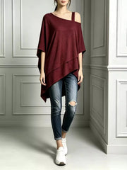 Burgundy women's asymmetrical-neck short-sleeve tunic top modeled with cuffed jeans and white sneakers