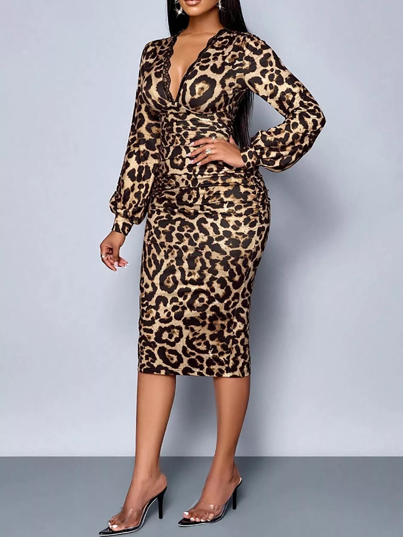 Front view of leopard print bodycon midi dress with hand on hip and long sleeves