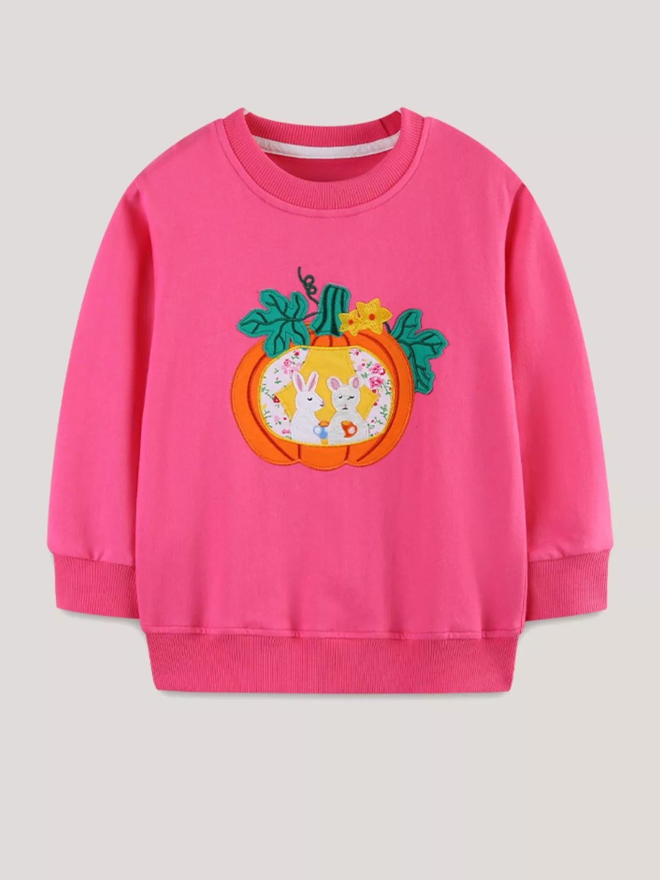 Flat front view of the strawberry pink sweatshirt with a pumpkin and rabbit applique