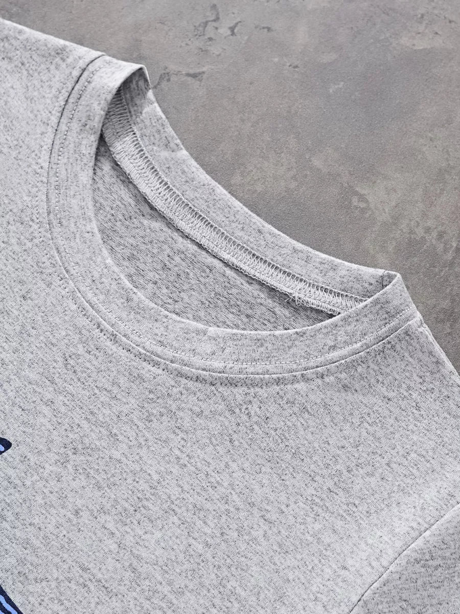 Close up of the light gray round neckline and fine stitching on the children's T-shirt