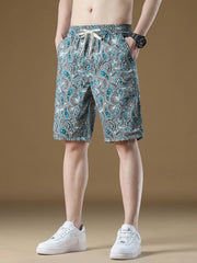 Men's French blue paisley-print shorts with a drawstring waist.