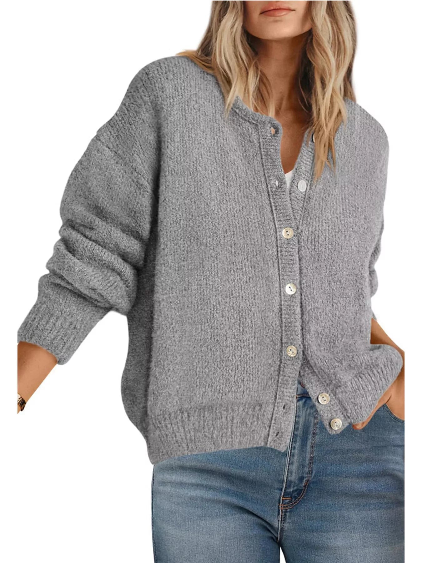 Front view of gray button down cardigan with white buttons worn with blue jeans