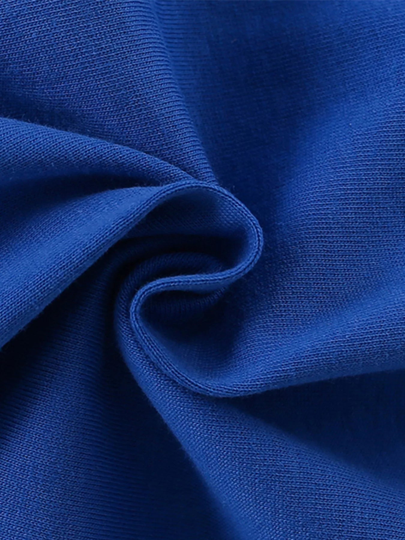 Close view of the soft indigo fabric texture of a children's t shirt