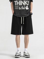 Men's black loose-fit casual shorts with a drawstring waist.