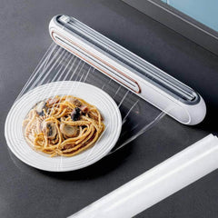 Refillable magnetic plastic wrap dispenser with cutter: for foil and film in the kitchen