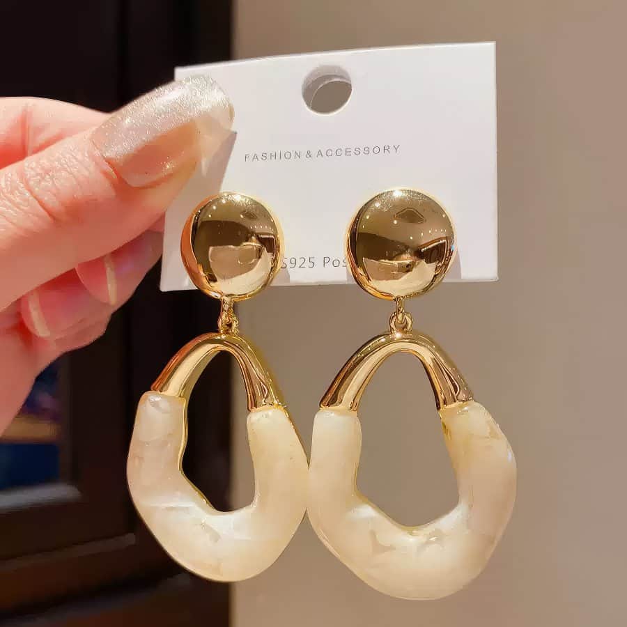 Stylish Gold Tone Drop Earrings with Round Top and Irregular Creamy White Geometric Inset Gold