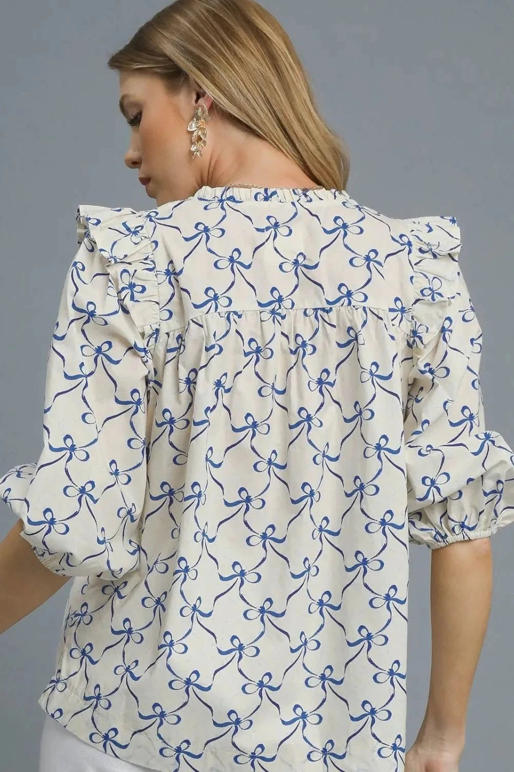 Umgee Ruffled Bow Print Notched Blouse